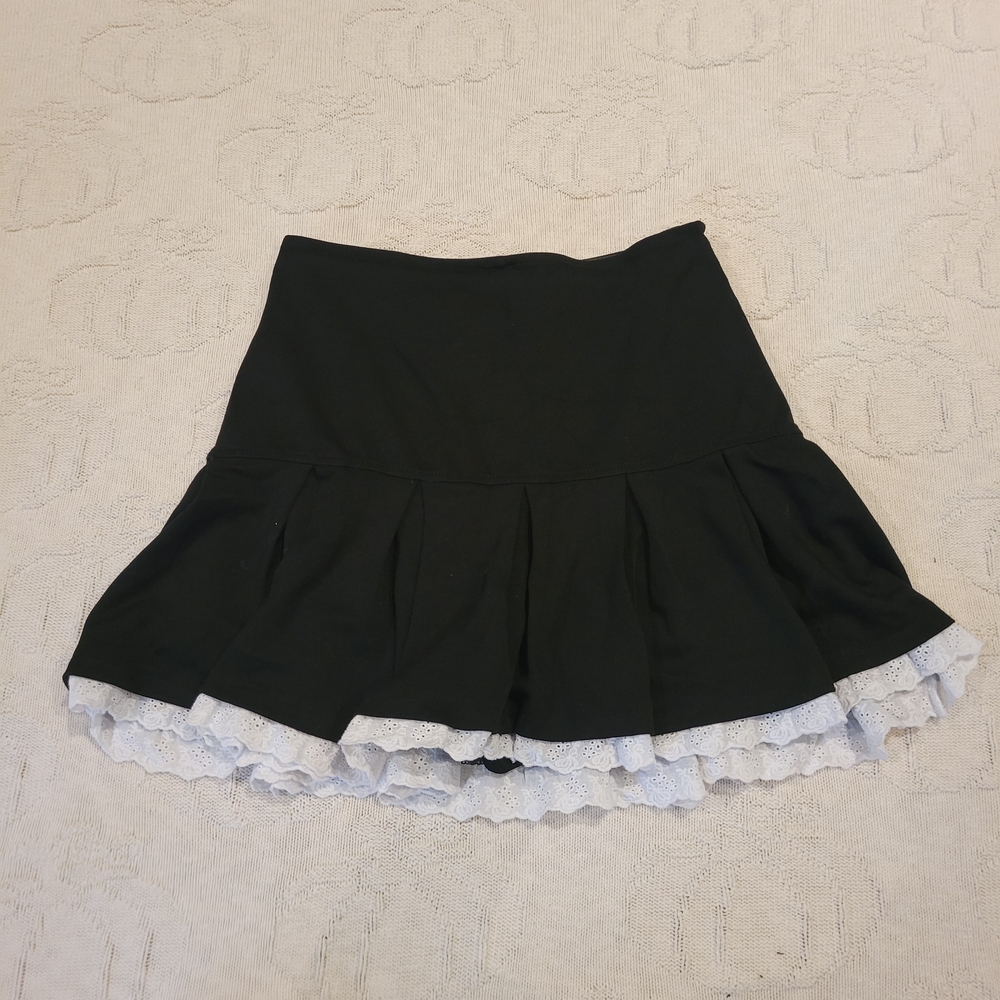 ★ . black skirt with white lace hem